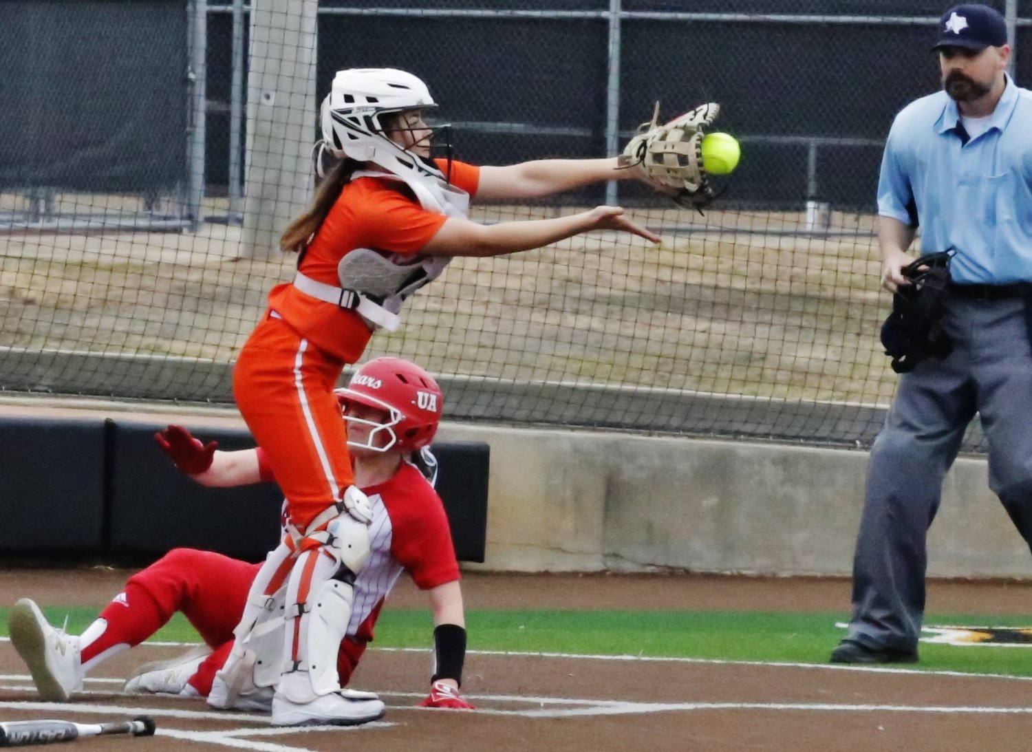 Lady Jacket catcher Jaycee Smith takes a throw at the plate in tournament action last Saturday.